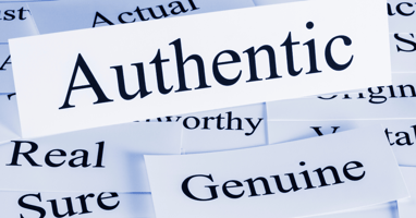 A collage of words on white paper, with “Authentic” prominently displayed in bold black font. Surrounding words include “Real,” “Genuine,” “Worthy,” and “Actual,” reinforcing themes of authenticity and trust.